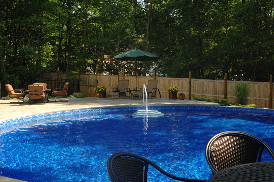 Residential above ground pool project integrated into the outdoor living area